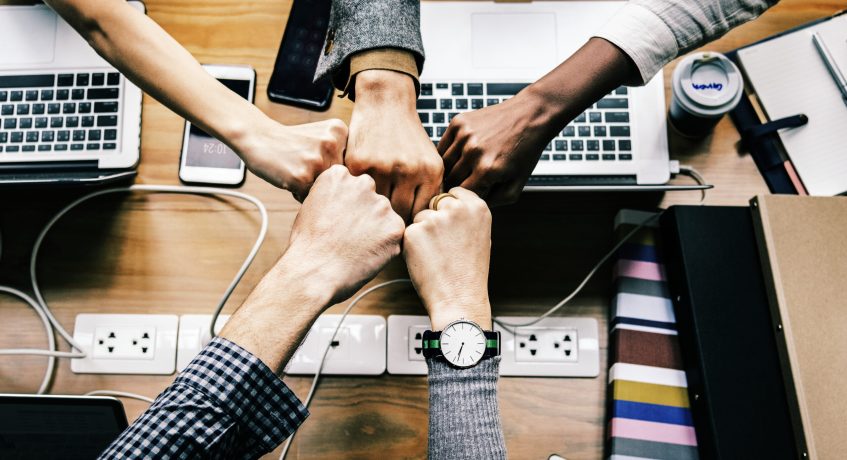 Colleagues giving a fist bump