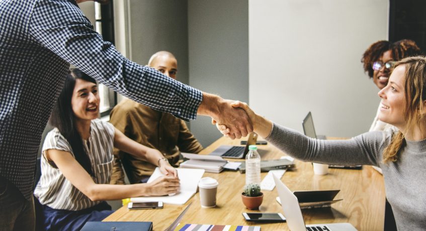 Business people shaking hands in agreement